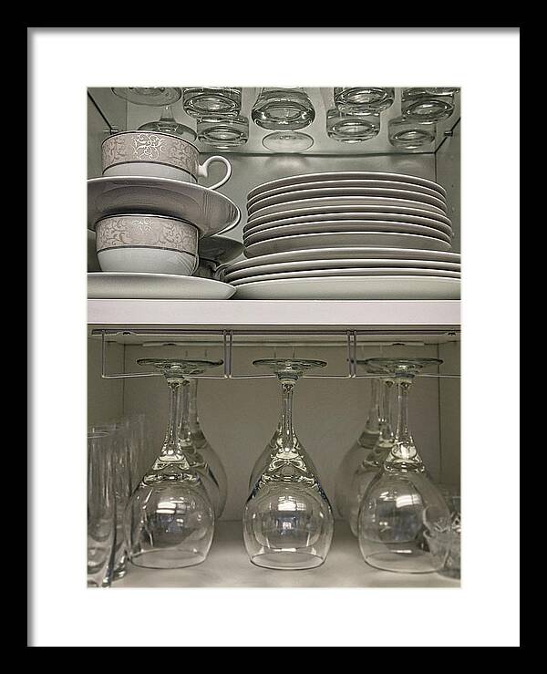 Table Framed Print featuring the photograph Cupboard - wine glasses and plates by Portia Olaughlin