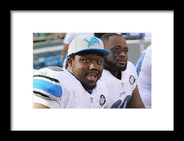Following Framed Print featuring the photograph Detroit Lions v New York Jets by Al Pereira