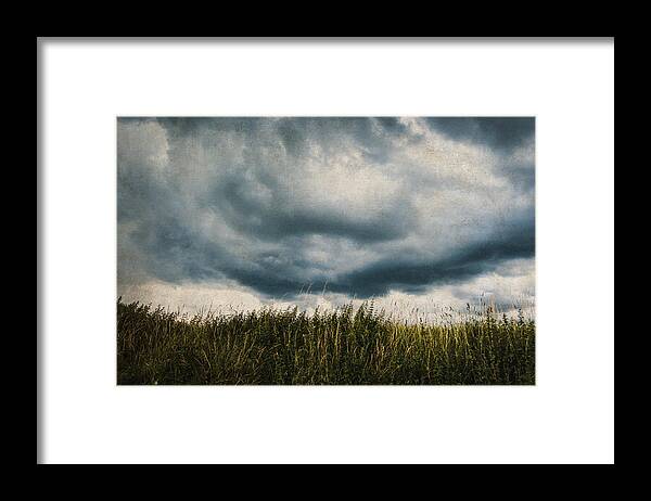 Land Framed Print featuring the photograph Disturbed sky by Yasmina Baggili