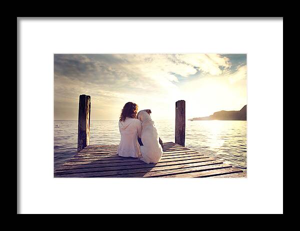 Teamwork Framed Print featuring the photograph Dog Rests Gently On His Master's Shoulder While Looking View by Fcscafeine