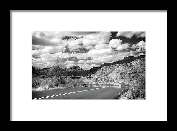Dramatic Badlands Road Framed Print featuring the photograph Dramatic Badlands Road by Dan Sproul