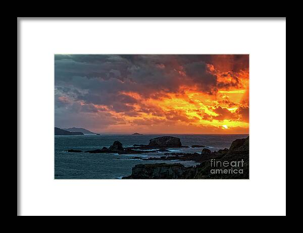 Stone Framed Print featuring the photograph Dramatic Sky of Fire over Miranda Islands at the Mouth of Ares Estuary La Coruna Galicia by Pablo Avanzini