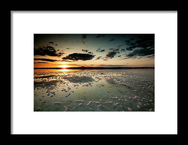 Sunset Framed Print featuring the photograph Dramatic winter sunset in the lake. by Michalakis Ppalis