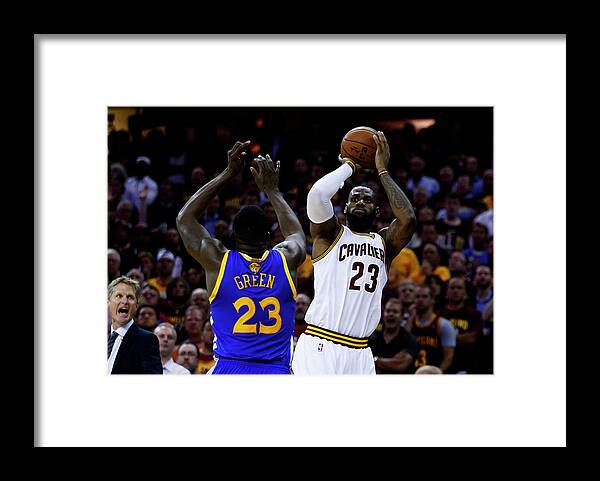Playoffs Framed Print featuring the photograph Draymond Green and Lebron James by Ezra Shaw