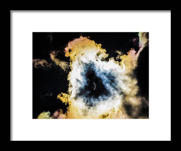 Clouds Framed Print featuring the photograph Eclipse Between the Clouds by Karen Cox