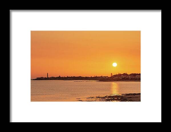 Sicily Framed Print featuring the photograph Enjoying an orange warm sunset over the sea in Sicily by Mirko Chessari