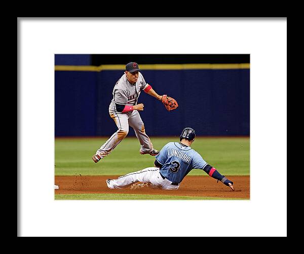 Following Framed Print featuring the photograph Evan Longoria and Asdrubal Cabrera by Mike Carlson