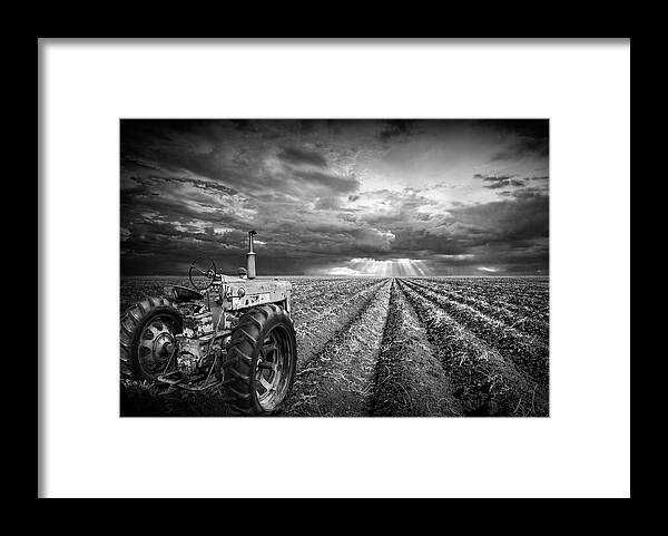 Art Framed Print featuring the photograph Farmall Tractor with Field Furrows and Sunburst Sky in Black and by Randall Nyhof