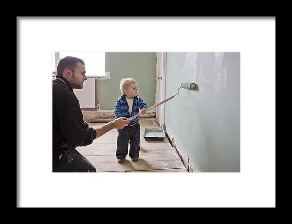 Three Quarter Length Framed Print featuring the photograph Father and son painting wall by Kate Mitchell