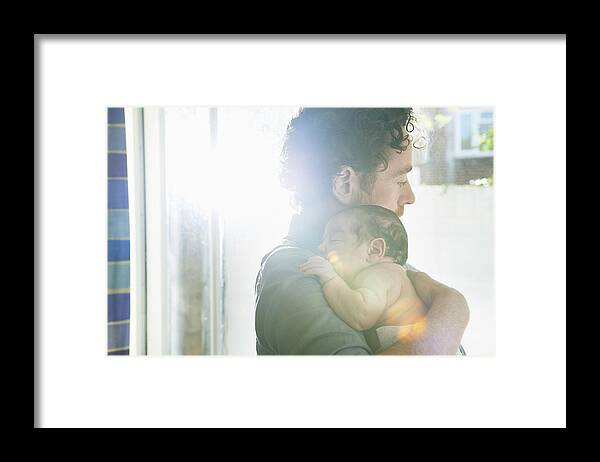 People Framed Print featuring the photograph Father Holding Baby by Tara Moore