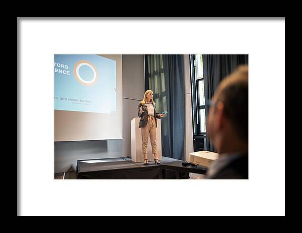 New Business Framed Print featuring the photograph Female professional giving presentation in a conference by Luis Alvarez
