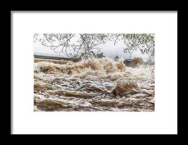 Underwater Framed Print featuring the photograph Flooded river during persistent heavy rain. by SimpleImages