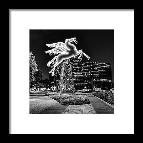 Dallas Skyline Framed Print featuring the photograph Flying Pegasus in Downtown Dallas Texas - Black and White by Gregory Ballos