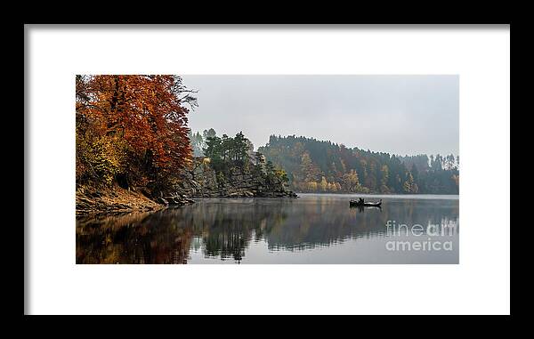 Austria Framed Print featuring the photograph Foggy Landscape With Fishermans Boat On Calm Lake And Autumnal Forest At Lake Ottenstein In Austria by Andreas Berthold