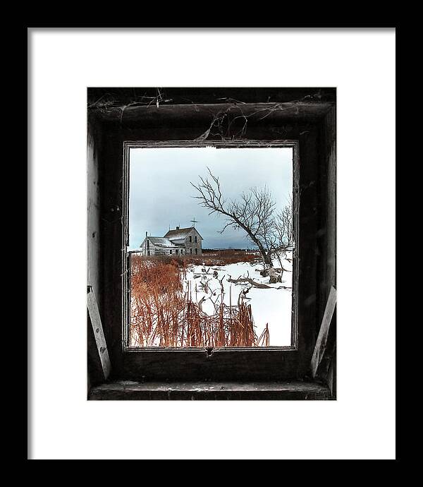 Abandoned Homestead Farmhouse Desolate Framed Architecture Rural Nd North Dakota Winter Scenic Landscape Vertical Windswept Framed Print featuring the photograph Framed Memories #1 of 2 - Stensby homestead captured through chicken coop window in winter by Peter Herman