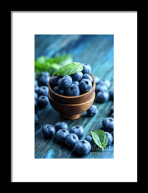 Blueberries Framed Print featuring the photograph Fresh Blueberries in wooden bowl close up by Jelena Jovanovic