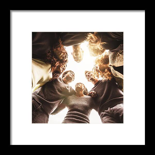 Adolescence Framed Print featuring the photograph Friends embraced enjoy looking down by Franckreporter