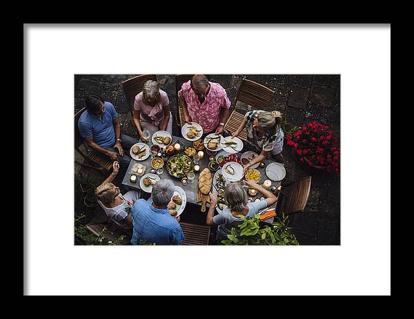 Scenics Framed Print featuring the photograph Friends Outdoors Dining by SolStock