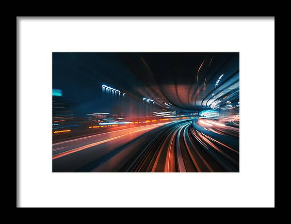 Rail Transportation Framed Print featuring the photograph Futuristic High Speed Light Tail with Night City Background by Nikada