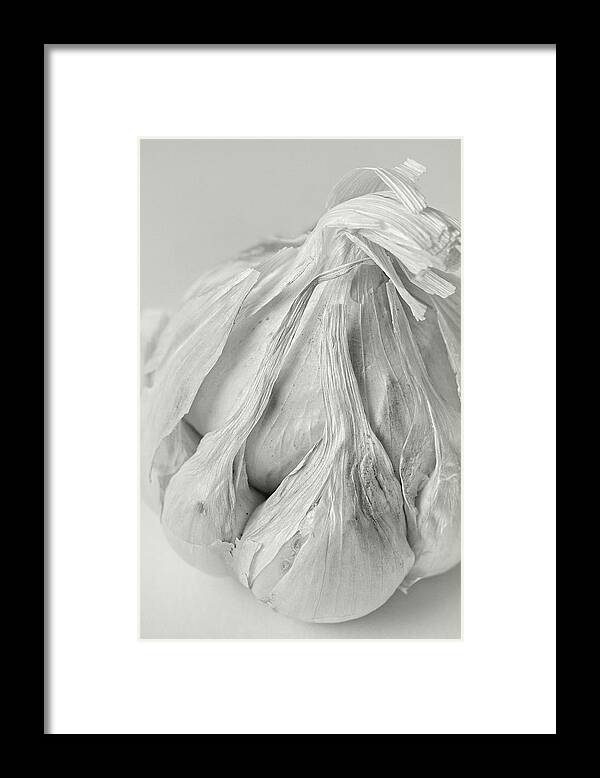 Abstract Framed Print featuring the photograph Garlic Clove Abstract by Richard Rizzo