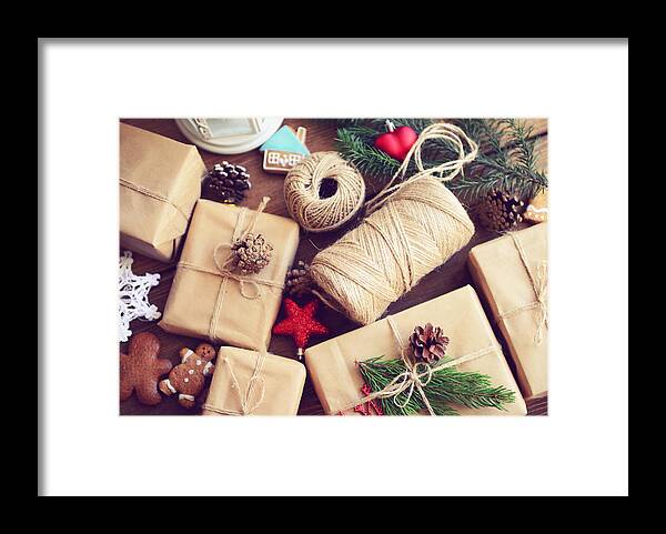 Holiday Framed Print featuring the photograph Gift Box On A Wooden Background by Elenaleonova