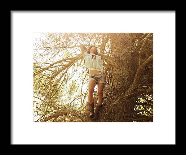 Tranquility Framed Print featuring the photograph Girl in a tree by Devon Strong