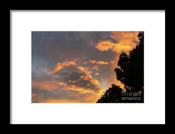 Clouds Framed Print featuring the photograph Glowing sky by Adriana Mueller