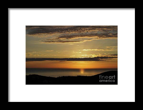 Clouds Framed Print featuring the photograph Golden sunrise over the sea by Adriana Mueller