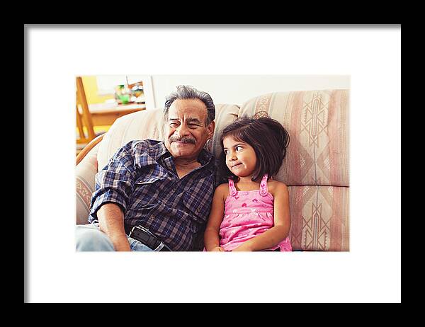 4-5 Years Framed Print featuring the photograph Grandfather and Granddaughter Laughing on Couch by Laura Olivas