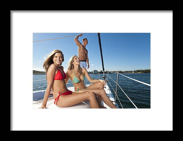 Sailboat Framed Print featuring the photograph Group of friends having fun on a yacht by Courtneyk