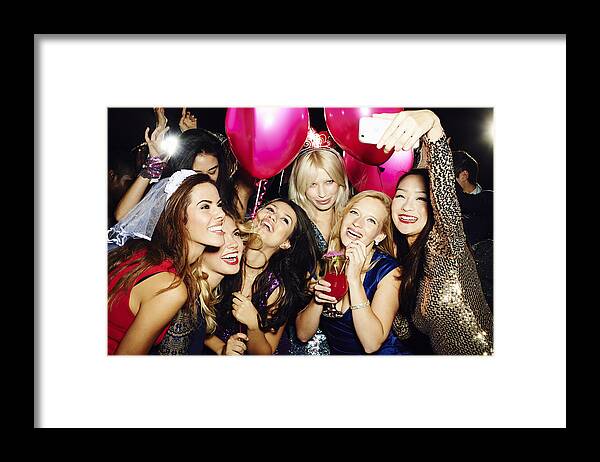 Mid Adult Women Framed Print featuring the photograph Group of friends taking self portrait with phone by Flashpop
