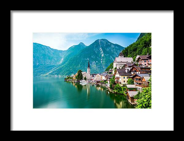 Water's Edge Framed Print featuring the photograph Hallstatt Village and Hallstatter See lake in Austria by Chunyip Wong