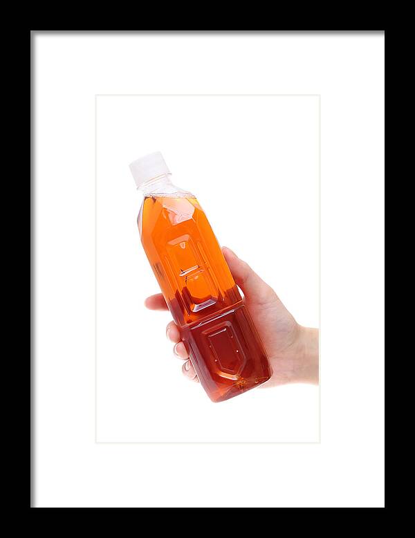 Palm Of Hand Framed Print featuring the photograph Hand holding bottle of tea by Akiyoko