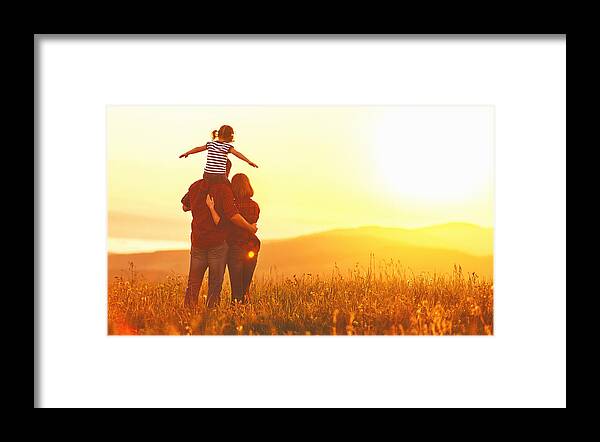 Fun Framed Print featuring the photograph Happy family: mother father and child daughter on sunset by Evgenyatamanenko
