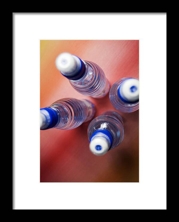 Outdoors Framed Print featuring the photograph High angle view of four water bottles by Glowimages