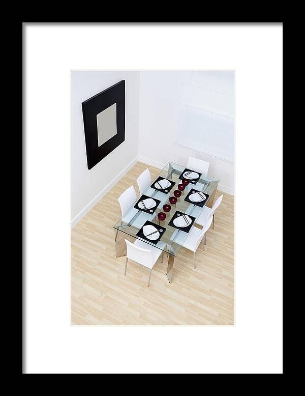 Dining Room Framed Print featuring the photograph High angle view of set table and chairs in modern dining room by Camilo Morales