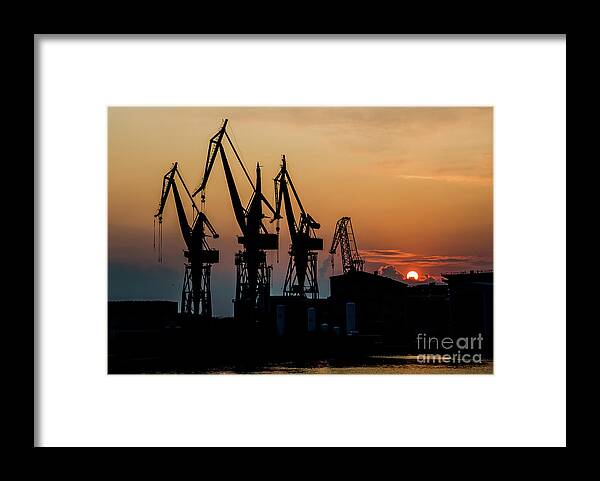 Building Framed Print featuring the photograph High Cranes At Sunset In Harbor Docks Of Pula Croatia by Andreas Berthold