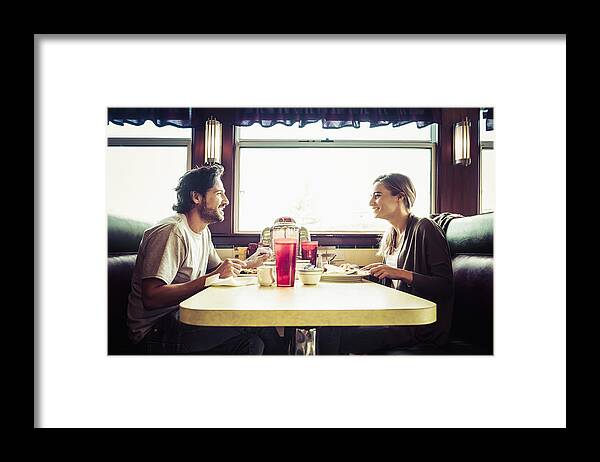 Breakfast Framed Print featuring the photograph Hispanic couple eating breakfast in diner by Jacobs Stock Photography Ltd