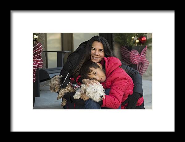 Pets Framed Print featuring the photograph Holiday season portrait of mother, son and dogs outdoors. by Martinedoucet