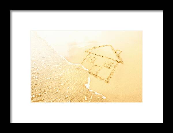 Problems Framed Print featuring the photograph House in sand washed away by waves by Dan Brownsword