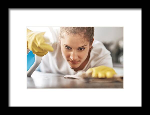 Working Framed Print featuring the photograph I won't leave a spot behind by PeopleImages