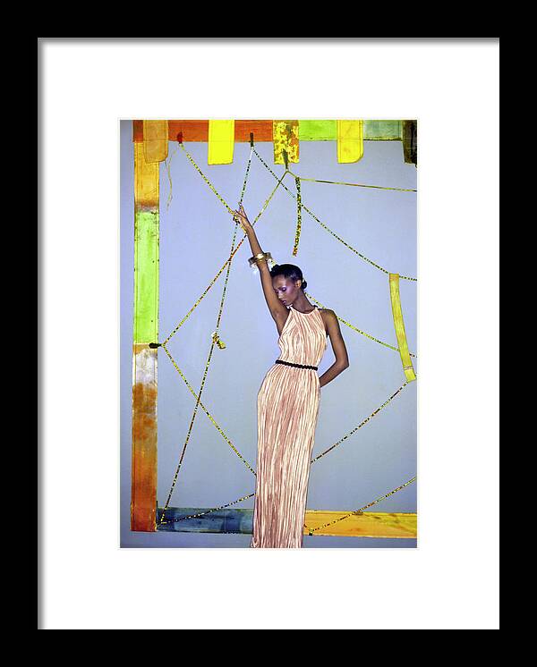 Art Framed Print featuring the photograph Iman Wearing A Pink Mary McFadden Pleated Dress by Ishimuro