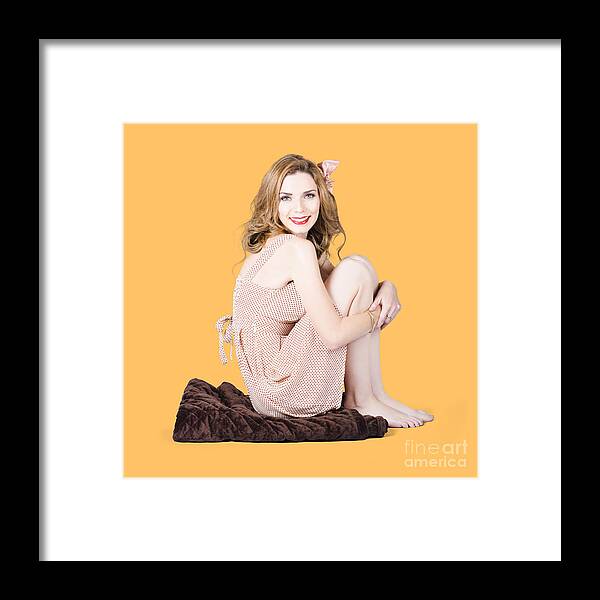 Beauty Framed Print featuring the photograph Isolated pinup girl sitting on soft blanket by Jorgo Photography