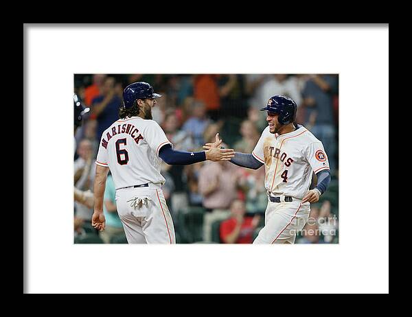 American League Baseball Framed Print featuring the photograph Jake Marisnick and George Springer by Bob Levey