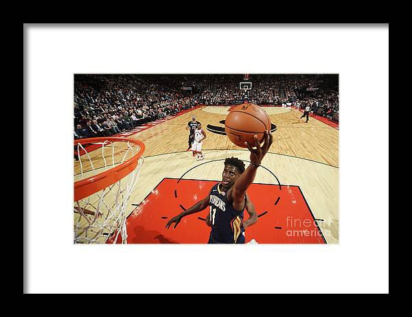 Nba Pro Basketball Framed Print featuring the photograph Jrue Holiday by Ron Turenne