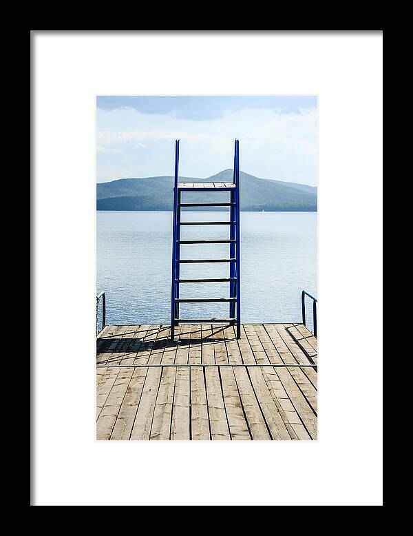 Tranquility Framed Print featuring the photograph Jump tower on the bridge boat on lake in summer by Andrei Troitskiy