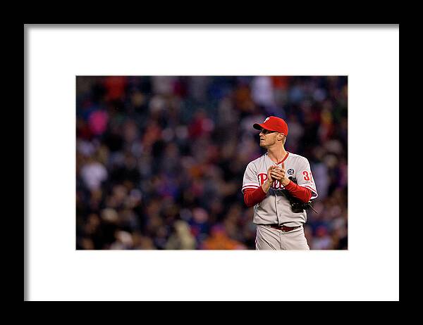 Defeat Framed Print featuring the photograph Justin Morneau and Kyle Kendrick by Justin Edmonds