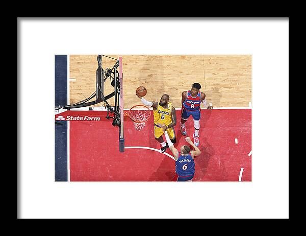 Lebron James Framed Print featuring the photograph Karl Malone and Lebron James by Stephen Gosling