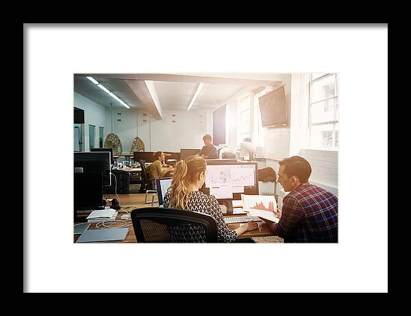 Using Computer Framed Print featuring the photograph Keeping each other updated on business developments by Pixdeluxe