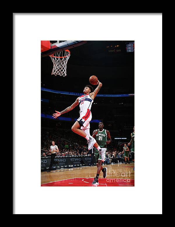 Nba Pro Basketball Framed Print featuring the photograph Kelly Oubre and Tony Snell by Ned Dishman